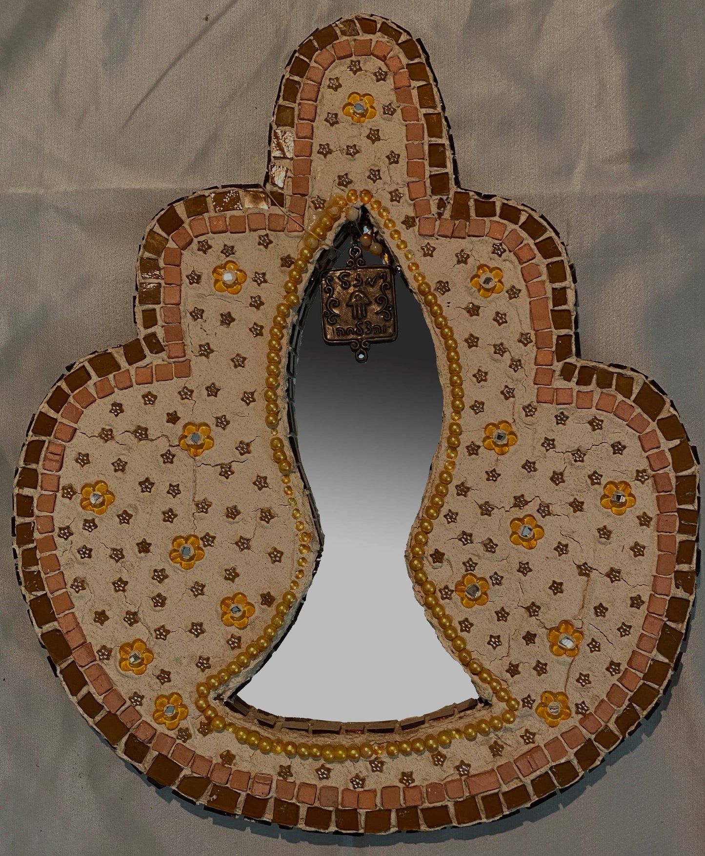 Hamsa fish mirror in orange